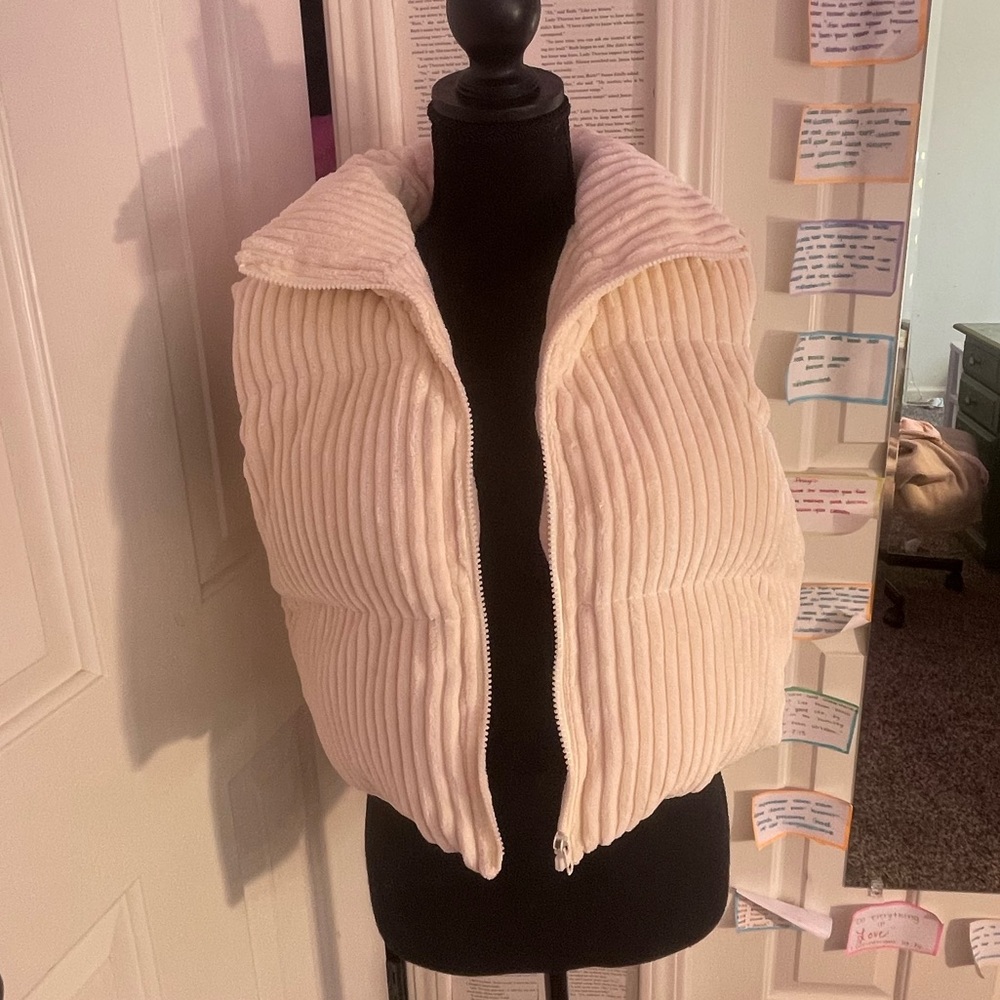 cream colored puffer vest